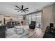 Bright and open living room with a view into the kitchen and sliding door to the patio at 2651 Deep Canyon St, Henderson, NV 89044
