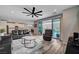 Spacious living room with hardwood floors, stylish furniture, and easy access to the kitchen at 2651 Deep Canyon St, Henderson, NV 89044
