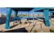 A community pool featuring lounge chairs and blue fabric sun canopies at 2651 Deep Canyon St, Henderson, NV 89044