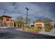 A view of the shopping center featuring several businesses, including Wells Fargo, in a well-maintained commercial area at 2651 Deep Canyon St, Henderson, NV 89044