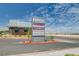 Shopping center featuring diverse businesses such as Milestone Academy, Starbucks, and Luxury Nails, set against a bright blue sky at 2651 Deep Canyon St, Henderson, NV 89044