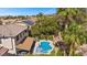 Tranquil aerial view of a backyard retreat featuring a sparkling pool and lush greenery at 2717 Cool Lilac Ave, Henderson, NV 89052