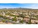 Expansive aerial view showcasing the neighborhood's serene setting with mountain backdrop and well-maintained landscaping at 2717 Cool Lilac Ave, Henderson, NV 89052