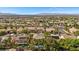An expansive community showcases well-manicured homes, mature trees, and a serene mountain vista in the background at 2717 Cool Lilac Ave, Henderson, NV 89052