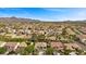 A vibrant community with well-maintained homes, lush greenery, and a picturesque mountain backdrop at 2717 Cool Lilac Ave, Henderson, NV 89052