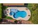 Inviting backyard oasis featuring a uniquely shaped pool, spa, and relaxing lounge area at 2717 Cool Lilac Ave, Henderson, NV 89052