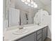 Bathroom with a double sink vanity, large mirror, and tub with shower at 2717 Cool Lilac Ave, Henderson, NV 89052