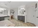 Bathroom with double sinks, gray cabinetry, and a view into the hall at 2717 Cool Lilac Ave, Henderson, NV 89052