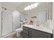 Bathroom featuring a shower with a glass door and vanity with a sink at 2717 Cool Lilac Ave, Henderson, NV 89052