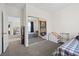 Well-lit bedroom featuring a mirrored closet and comfortable sleeping area at 2717 Cool Lilac Ave, Henderson, NV 89052
