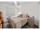 Bedroom with neutral decor and comfortable furnishings, including a dresser and nightstand at 2717 Cool Lilac Ave, Henderson, NV 89052