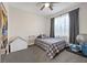 Cozy bedroom with ample natural light, a ceiling fan, and comfortable decor at 2717 Cool Lilac Ave, Henderson, NV 89052