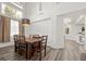 Dining room with tall ceilings, large window and wood dining table at 2717 Cool Lilac Ave, Henderson, NV 89052