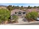 Charming home with landscaped yard and a convenient two-car garage and driveway at 2717 Cool Lilac Ave, Henderson, NV 89052