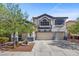 Classic home with a well-manicured lawn, a two-car garage, and charming curb appeal at 2717 Cool Lilac Ave, Henderson, NV 89052