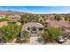 Traditional two-story house with a front yard and a two car garage at 2717 Cool Lilac Ave, Henderson, NV 89052