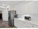 Kitchen featuring white cabinets, stainless steel appliances and subway tile backsplash at 2717 Cool Lilac Ave, Henderson, NV 89052