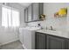 Laundry room with updated appliances and sink at 2717 Cool Lilac Ave, Henderson, NV 89052