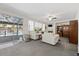 Cozy living room with fireplace, neutral furniture, and backyard pool access at 2717 Cool Lilac Ave, Henderson, NV 89052