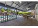 An inviting covered patio area with a pool, seating, and lush greenery surrounding the outdoor space at 2717 Cool Lilac Ave, Henderson, NV 89052