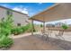 Charming backyard patio with seating area and shaded pergola at 311 Lilian Faith Ave, North Las Vegas, NV 89031