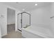 Modern bathroom showcasing a standalone tub and a black-framed glass shower at 311 Lilian Faith Ave, North Las Vegas, NV 89031