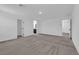 Spacious bedroom with neutral carpet, and a view into an attached bathroom at 311 Lilian Faith Ave, North Las Vegas, NV 89031