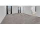 Expansive bedroom with carpet, windows, and an ensuite bathroom featuring a soaking tub at 311 Lilian Faith Ave, North Las Vegas, NV 89031