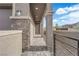 Inviting entryway featuring stone accents, a paved walkway, and a contemporary design, leading to the front door at 311 Lilian Faith Ave, North Las Vegas, NV 89031