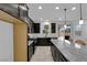 Spacious kitchen featuring stainless steel appliances, granite countertops, and island with seating at 311 Lilian Faith Ave, North Las Vegas, NV 89031