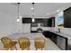 Modern kitchen featuring stainless steel appliances, granite countertops, island with seating and a dishwasher at 311 Lilian Faith Ave, North Las Vegas, NV 89031