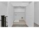 Laundry closet with tile flooring, plumbing hookups, and a shelf at 311 Lilian Faith Ave, North Las Vegas, NV 89031