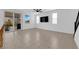 Bright living room with sliding glass doors to patio, sleek tile flooring, ceiling fan and a modern design at 311 Lilian Faith Ave, North Las Vegas, NV 89031