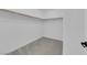Bright walk-in closet featuring carpet and a wooden closet rod with supports at 311 Lilian Faith Ave, North Las Vegas, NV 89031