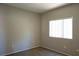 Bedroom with a window, plush carpet, neutral paint, and ample natural light; a serene retreat at 3400 Cabana Dr # 2010, Las Vegas, NV 89122