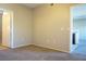Comfortable bedroom with neutral walls and flooring, leading to a well-lit bathroom at 3400 Cabana Dr # 2010, Las Vegas, NV 89122