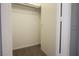 Inside walk-in closet featuring carpeted floor, white shelving, and an open door for easy access at 3400 Cabana Dr # 2010, Las Vegas, NV 89122