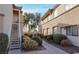 A well-maintained condo building with lush landscaping and pedestrian-friendly sidewalks at 3400 Cabana Dr # 2010, Las Vegas, NV 89122