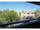 A view from a balcony shows parking and the exteriors of adjacent condo buildings at 3400 Cabana Dr # 2010, Las Vegas, NV 89122