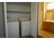 Convenient laundry closet with washer, dryer, and shelving, located near a bathroom vanity area at 3400 Cabana Dr # 2010, Las Vegas, NV 89122