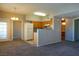Comfortable living space featuring neutral carpet, with easy access to the kitchen and bathroom at 3400 Cabana Dr # 2010, Las Vegas, NV 89122