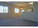 Bright living room with large windows, a ceiling fan, and neutral carpeting for a cozy atmosphere at 3400 Cabana Dr # 2010, Las Vegas, NV 89122