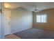 Spacious living room with neutral walls, carpet flooring, a ceiling fan, and natural light streaming in at 3400 Cabana Dr # 2010, Las Vegas, NV 89122