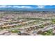 Expansive aerial view of a large neighborhood showcasing the city skyline and mountain range in the background at 362 Port Reggio St, Las Vegas, NV 89138