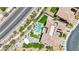 Bird's eye view of this beautiful home features a sparkling pool, outdoor kitchen and lush greenery at 362 Port Reggio St, Las Vegas, NV 89138