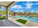 Backyard featuring a pool with waterfall features and an outdoor kitchen area at 362 Port Reggio St, Las Vegas, NV 89138
