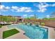 Beautiful backyard pool with waterfall features and manicured landscaping at 362 Port Reggio St, Las Vegas, NV 89138