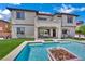 Backyard pool and patio area with a modern outdoor living space and water feature at 362 Port Reggio St, Las Vegas, NV 89138
