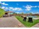 Well-maintained backyard with lounge chairs, outdoor kitchen, and landscaping at 362 Port Reggio St, Las Vegas, NV 89138