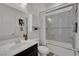 Bathroom featuring a single sink vanity, and tiled shower with glass door at 362 Port Reggio St, Las Vegas, NV 89138